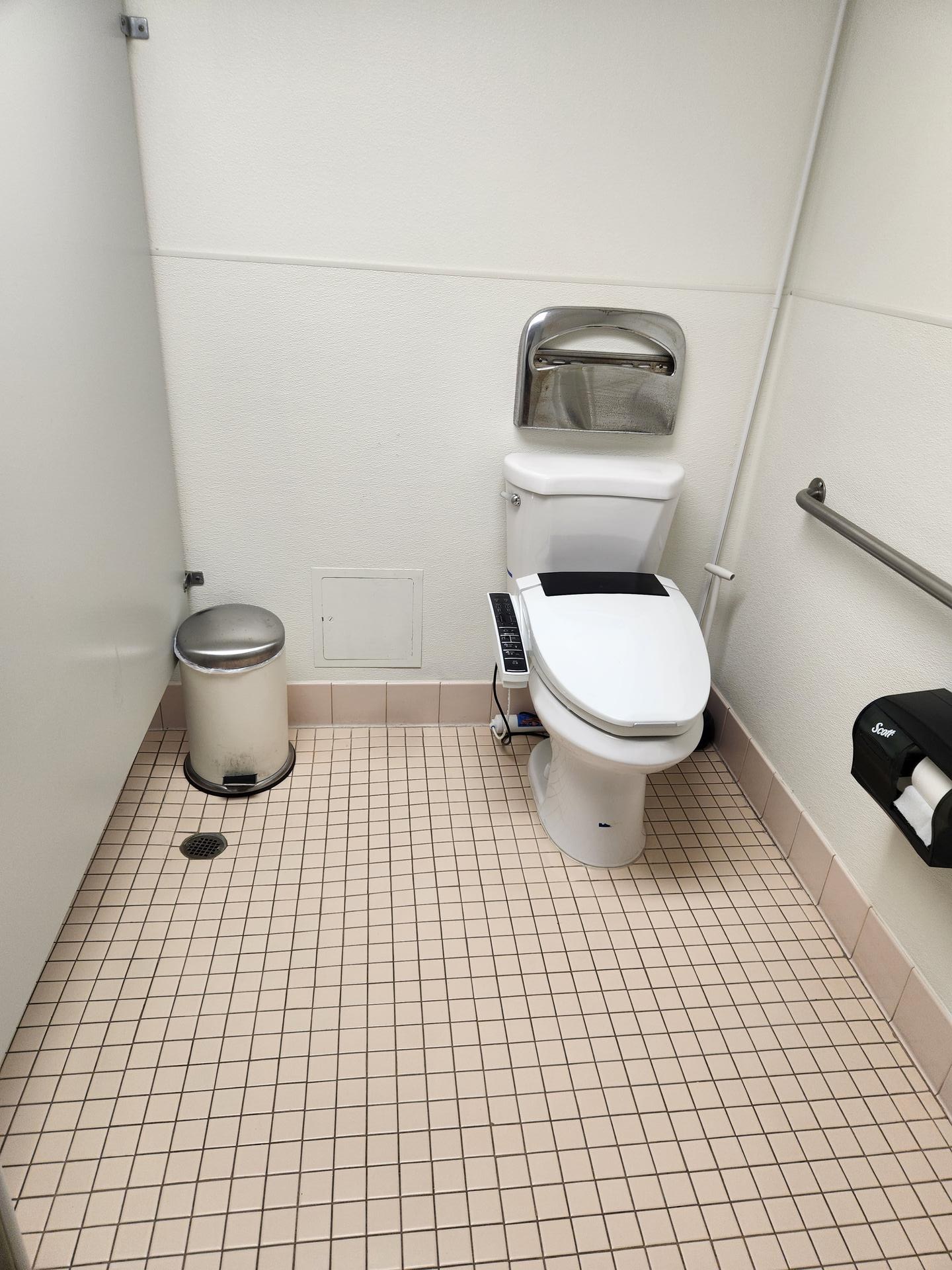 Office bathroom stall cleaned