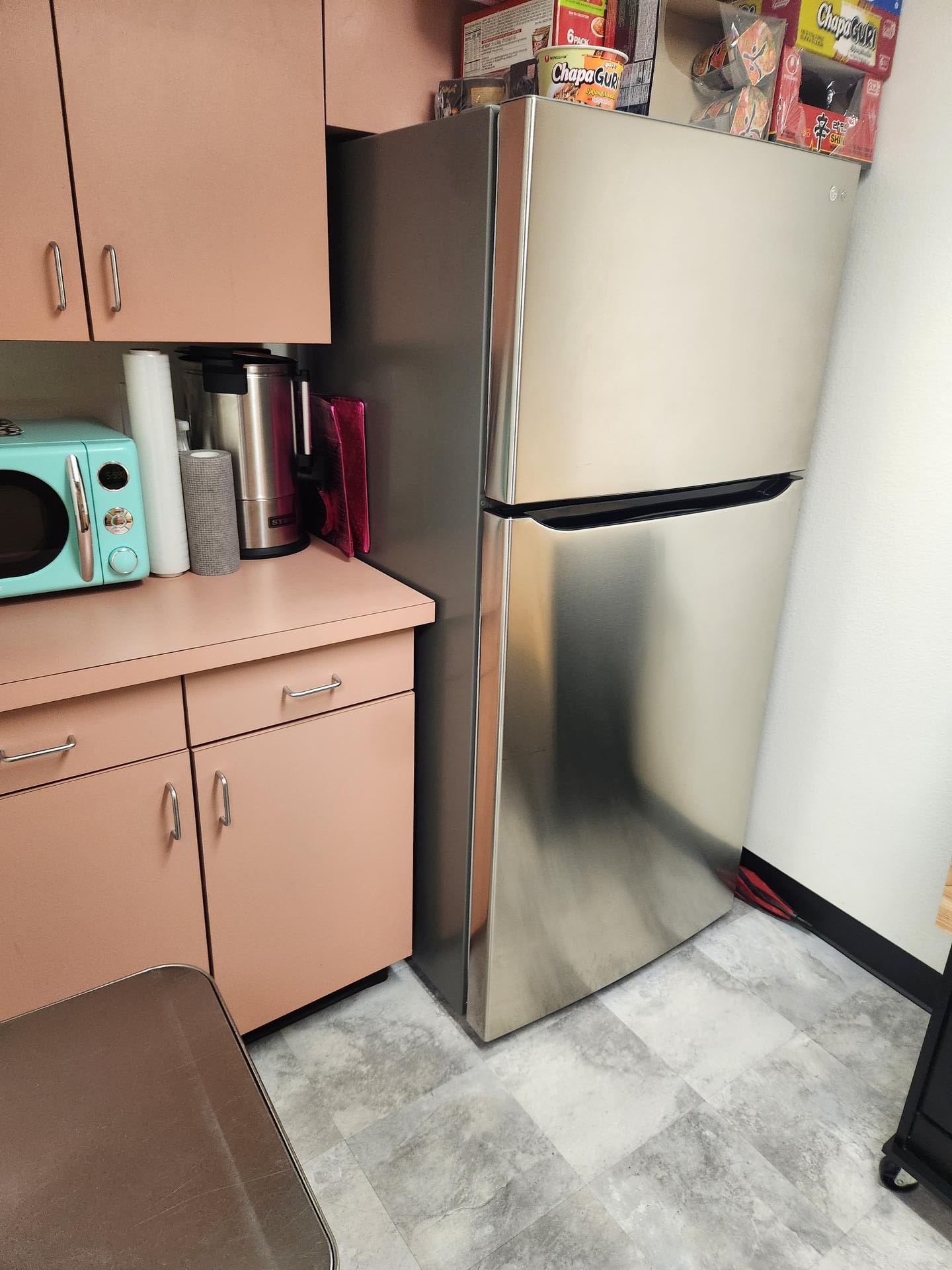 Office kitchenette fridge area cleaned